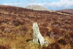 Marrogh-standing-stone-with-chambered-cairn-behind